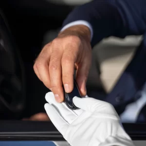 high-angle-hands-holding-key